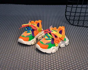 Close-up of vibrant mesh upper and durable non-slip rubber sole of girl's dad sneakers