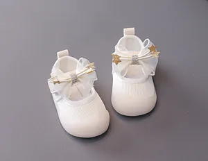 Detail of baby princess shoes with mesh bow, sequin stars and rhinestone accents