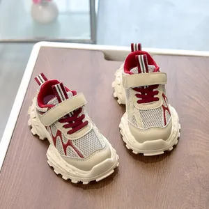 Detail view of breathable mesh upper and durable Velcro strap on children sneakers
