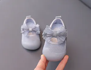 Detail of baby princess shoe featuring breathable mesh fabric and sparkling bow with stars