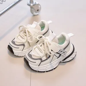 Detail view of breathable mesh kids sneakers with Velcro straps and thick anti-slip soles