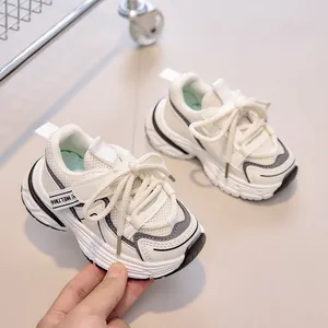 Detail view of breathable mesh upper and velcro strap on kids chunky sneakers