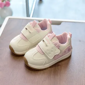 Kids casual sneakers in cream and pink with heart pattern and velcro closure
