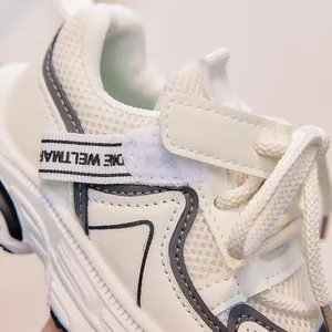 Close-up of breathable mesh fabric and durable synthetic leather on kids' sports sneakers