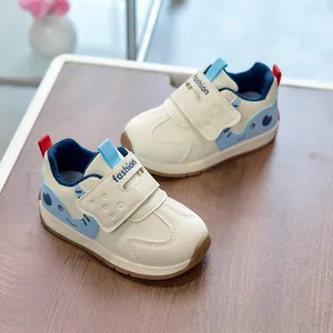 Detail of toddler sneaker with cute cartoon elephant, velcro strap and non-slip rubber sole
