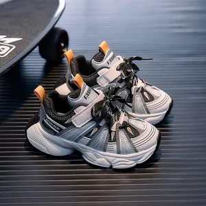 Detail view of children's chunky sneakers with mesh upper and slip-resistant thick sole