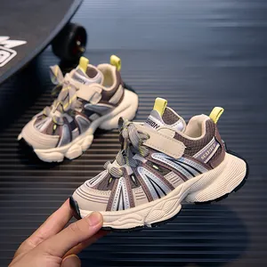 Detailed close-up of kids' chunky sneaker featuring multi-color panels and non-slip sole