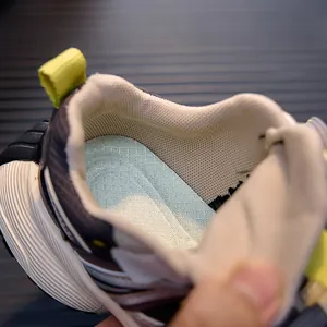 Detail showing breathable mesh lining and anti-slip diamond texture insole of kids sneakers
