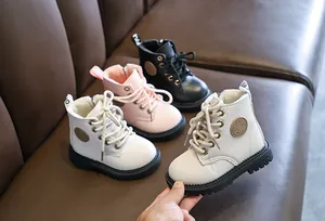 Three pairs of kids Martin boots in white pink and black with anti-slip rubber soles