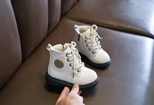 Detail of white children's boots showing soft warm fleece lining and sturdy side zipper