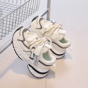 Detail of breathable mesh and hook-and-loop strap on kids' chunky athletic sneakers