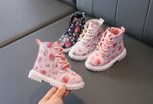 Detailed view of pink toddler boots with cute strawberry prints and side zipper