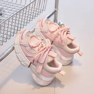 Detail of pink mesh kids sneakers with breathable leather panels and thick non-slip soles