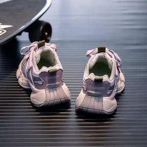 Detail view of purple and white kids' mesh sneakers featuring FASHION heel text