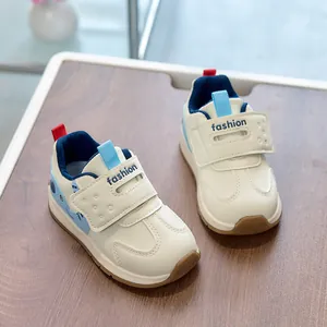 Detail view of toddler sneakers with cute cartoon animal pattern and velcro strap design
