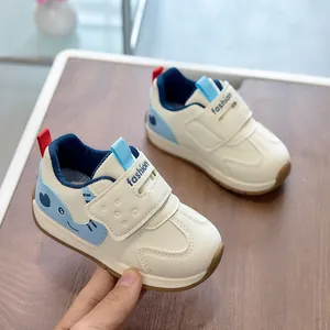 Detail of kids sneaker with cute blue elephant pattern and convenient velcro closure