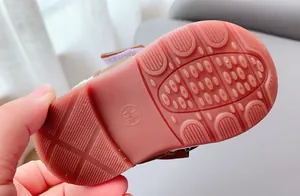 Macro detail of toddler shoes anti-slip rubber sole with texture and size marking