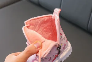 Close-up of pink toddler boots featuring thick warm fleece lining and side zipper detail