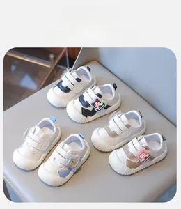 Detail view of leather baby walking shoes with protective toe caps and bear accents