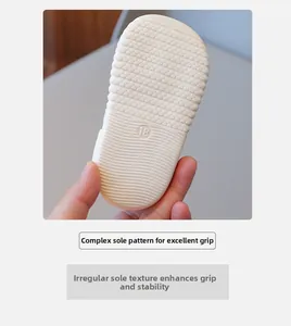 Detailed view of non-slip honeycomb rubber sole for infant toddler shoes with size 18 stamp