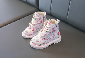 Detail of toddler boots featuring strawberry prints and side zipper for easy wear