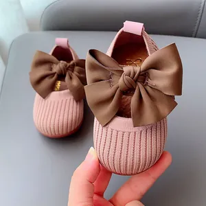 Pink striped knit baby girl shoes with a large brown bow and soft non-slip soles