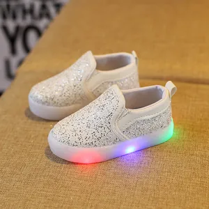 Kids silver sequin slip-on shoes with glowing colorful LED light-up soles for boys and girls