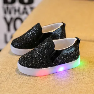 Kids black sequin slip-on sneakers with LED light-up translucent thick soles