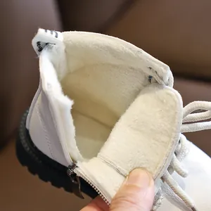 White leather kids Martin boots with thick fleece lining and durable rubber sole