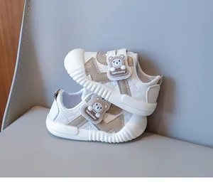 Close-up of baby walking shoes with cute bear logo and durable anti-slip rubber sole