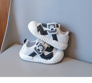 Detailed close-up of baby walking shoes featuring quilted texture and bear velcro strap