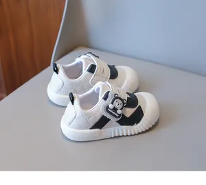 Detail of baby walking shoes featuring a cute bear Velcro strap and anti-slip rubber toe