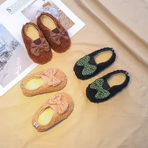 Plush lamb wool toddlers shoes with bow detail in brown black and pink colors