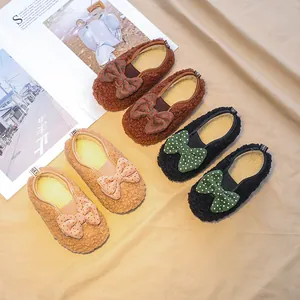 Plush lamb wool baby loafers with polka dot bows in brown, black, and beige colors