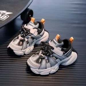 Kids chunky sports sneakers in white and grey with breathable mesh and velcro straps