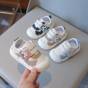 Baby non-slip soft sole walking shoes with cute bear decor in black, brown and blue