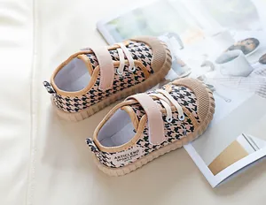 Detail of houndstooth pattern canvas shoes with velcro strap for toddler comfort