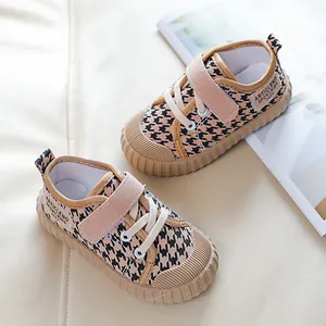Kids low-top canvas sneakers with khaki houndstooth pattern and non-slip rubber soles