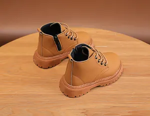 Detail of khaki kids martin boots with side zipper and rugged anti-slip rubber sole