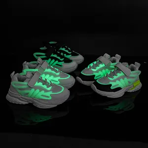 Luminous children's sports sneakers with breathable mesh, velcro straps, and glowing soles