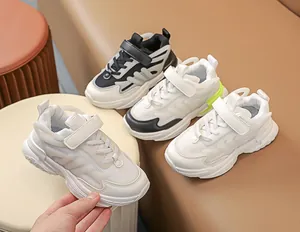 Close-up of children's mesh athletic shoes with velcro straps in three stylish color options
