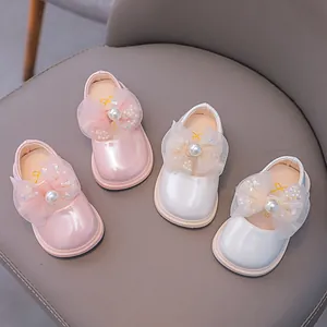 White and pink girls princess dress shoes with pearl bows and glossy patent leather