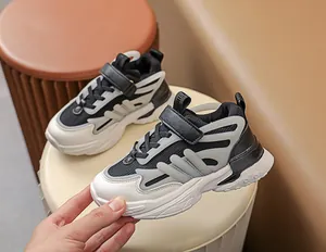 Detail of kids athletic sneaker with breathable mesh and hook and loop closure strap