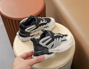 Detail view of kids color-block sneakers with mesh fabric and velcro strap closure