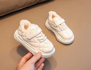 Detailed view of warm winter baby boots with quilted faux leather and plush fleece lining