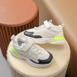 Breathable white kids chunky sneakers with neon green accents and velcro straps