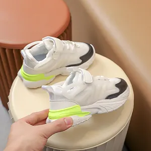 Detail of kids LED sneakers with breathable mesh, velcro strap, and glowing green heel
