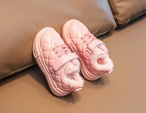 Detail of pink toddler winter boots with quilted patent leather and warm plush lining