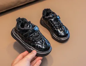 Detail of baby winter thermal sneakers with quilted pattern and thick plush lining