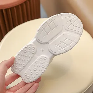 Close-up of non-slip rubber sole for children sneakers with size 28 engraving